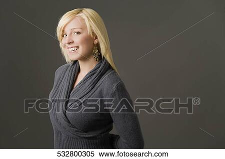 Portrait of a young woman smiling View Large Photo Image Stock Photography - Portrait of a young woman smiling. Fotosearch