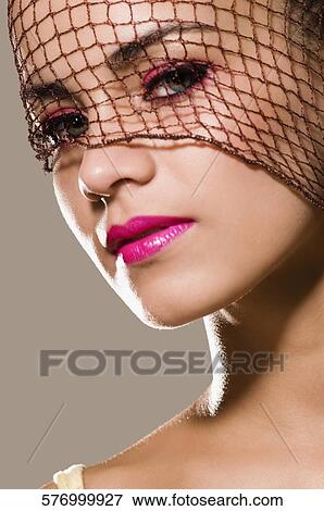 Portrait of a young woman View Large Photo Image Stock Photo - Portrait of a young woman. Fotosearch