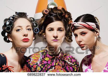 Portrait of three young women wearing hair rollers View Large Photo Image Stock Photo - Portrait of three young women wearing hair rollers. Fotosearch