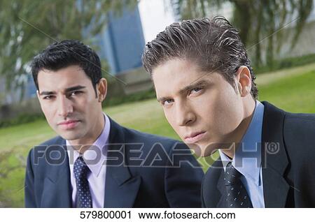 Portrait of two businessmen looking serious View Large Photo Image Stock Image - Portrait of two businessmen looking serious. Fotosearch