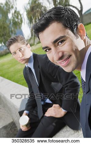 Portrait of two businessmen smiling View Large Photo Image Stock Photography - Portrait of two businessmen smiling. Fotosearch
