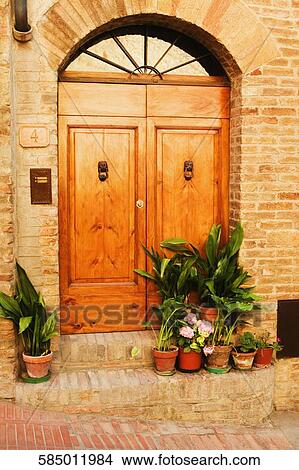 Potted plants outside a house, San Gimignano, Siena Province, Tuscany, Italy View Large Photo Image Picture - Potted plants outside a house, San Gimignano, Siena Province, Tuscany, Italy. Fotosearch