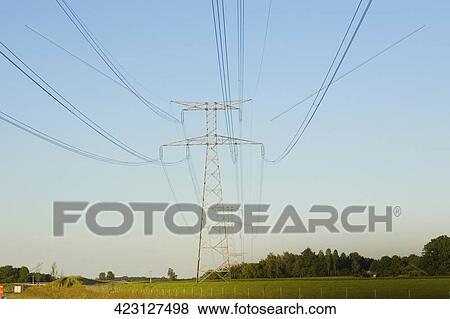 Power line passing over a field, Loire Valley, France View Large Photo Image Stock Photo - Power line passing over a field, Loire Valley, France. Fotosearch