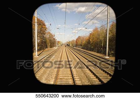 Railroad track viewed through a train window View Large Photo Image Stock Image - Railroad track viewed through a train window. Fotosearch