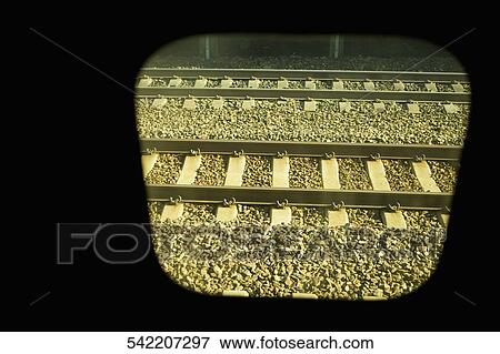 Railroad track viewed through a train window View Large Photo Image Stock Photo - Railroad track viewed through a train window. Fotosearch