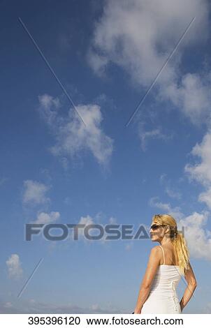 Rear view of a mid adult woman View Large Photo Image Stock Image - Rear view of a mid adult woman. Fotosearch