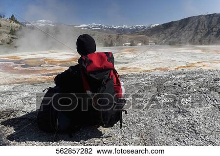 Rear view of a person sitting in front of a hot spring, Mammoth Hot Springs, Yellowstone Lake, Wyoming, USA View Large Photo Image Stock Image - Rear view of a person sitting in front of a hot spring, Mammoth Hot Springs, Yellowstone Lake, Wyoming, USA. Fotosearch