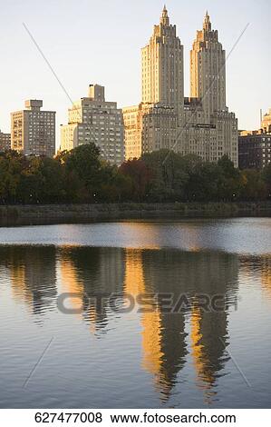 Reflection of buildings in water, San Remo Building, Central Park, Manhattan, New York City, New York State, USA View Large Photo Image Stock Photo - Reflection of buildings in water, San Remo Building, Central Park, Manhattan, New York City, New York State, USA. Fotosearch