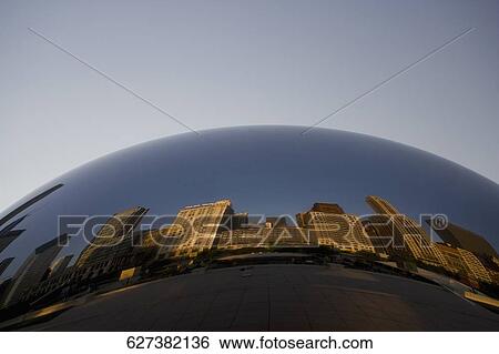 Stock Photograph - Reflection of buildings on a sculpture, The Bean, Cloud Gate, Millennium Park, Chicago, Illinois, USA. Fotosearch