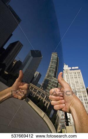 Reflection of thumbs up sign on a sculpture, Cloud Gate, Millennium Park, Chicago, Illinois, USA View Large Photo Image Stock Image - Reflection of thumbs up sign on a sculpture, Cloud Gate, Millennium Park, Chicago, Illinois, USA. Fotosearch