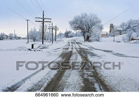 Road passing through a snow covered landscape View Large Photo Image Stock Image - Road passing through a snow covered landscape. Fotosearch