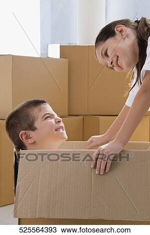 Side profile of a boy and a girl looking at each other and smiling View Large Photo Image Stock Image - Side profile of a boy and a girl looking at each other and smiling. Fotosearch