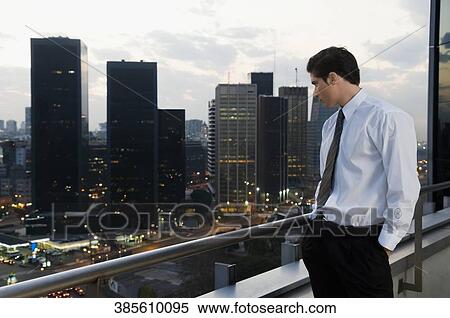 Side profile of a businessman looking down View Large Photo Image Stock Photography - Side profile of a businessman looking down. Fotosearch
