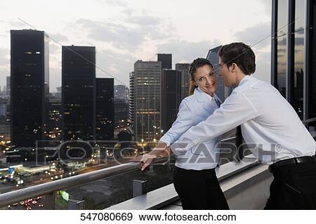 Side profile of a businesswoman and a businessman romancing View Large Photo Image Stock Photo - Side profile of a businesswoman and a businessman romancing. Fotosearch
