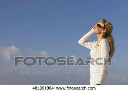 Side profile of a mid adult woman looking up View Large Photo Image Picture - Side profile of a mid adult woman looking up. Fotosearch