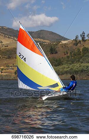 Side profile of a person participating in a sailboat race View Large Photo Image Stock Photograph - Side profile of a person participating in a sailboat race. Fotosearch