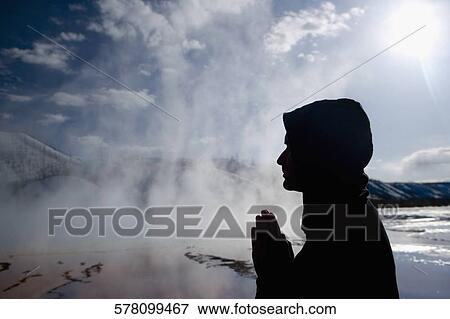 Silhouette of a man in a prayer position near a hot spring, Grand Prismatic Spring, Yellowstone National Park, Wyoming, USA View Large Photo Image Stock Photo - Silhouette of a man in a prayer position near a hot spring, Grand Prismatic Spring, Yellowstone National Park, Wyoming, USA. Fotosearch