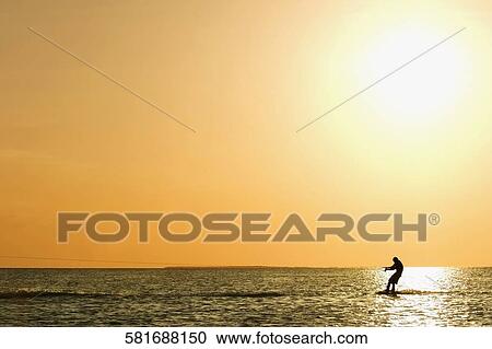 Silhouette of a person waterskiing, Florida Keys, Florida, USA View Large Photo Image Stock Image - Silhouette of a person waterskiing, Florida Keys, Florida, USA. Fotosearch