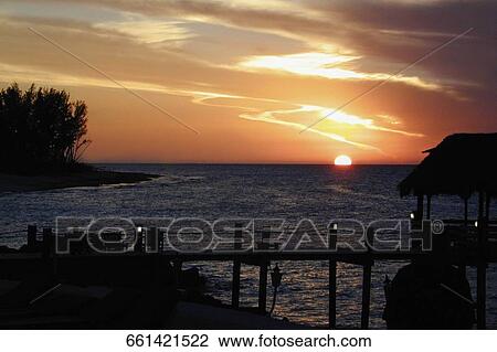 Silhouette of a stilt house View Large Photo Image Stock Image - Silhouette of a stilt house. Fotosearch