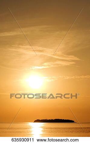 Stock Image - Silhouette of an island in the sea, Florida Keys, Florida, USA. Fotosearch