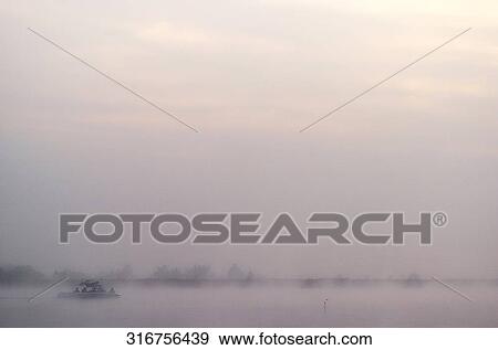 Silhouette of five people in a boat at sunset, Chiang Rai, Amphoe Mueang, Chiang Rai Province, Thailand View Large Photo Image Stock Photo - Silhouette of five people in a boat at sunset, Chiang Rai, Amphoe Mueang, Chiang Rai Province, Thailand. Fotosearch