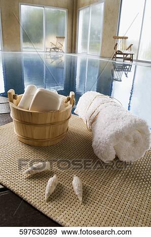 Stock Photo - Spa products at the poolside. Fotosearch