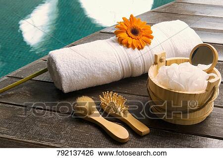 Stock Photograph - Spa products at the poolside. Fotosearch