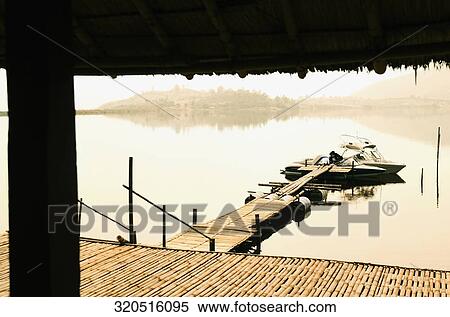 Speedboat docked at a pier, Tahiti, French Polynesia View Large Photo Image Stock Photography - Speedboat docked at a pier, Tahiti, French Polynesia. Fotosearch