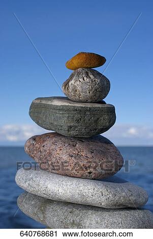 Stack of pebbles on the beach View Large Photo Image Stock Image - Stack of pebbles on the beach. Fotosearch