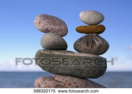Stacks of pebbles at the seaside View Large Photo Image Stock Photography - Stacks of pebbles at the seaside. Fotosearch