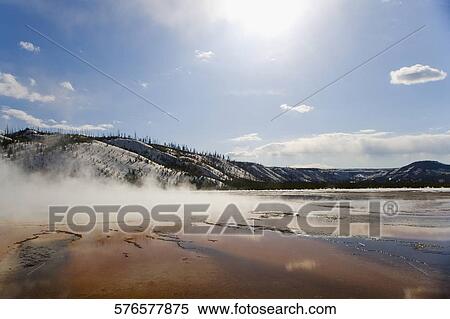 Stock Photography - Steam emerging from a hot spring, Grand Prismatic Spring, Yellowstone National park, Wyoming, USA. Fotosearch
