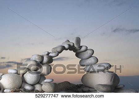 Stones arranged in an arch shape View Large Photo Image Stock Photo - Stones arranged in an arch shape. Fotosearch