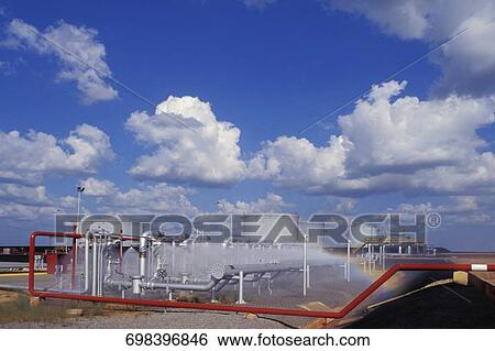 Storage tanks at an oil refinery View Large Photo Image Stock Photograph - Storage tanks at an oil refinery. Fotosearch
