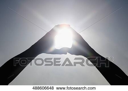 Sunlight shining through a finger frame View Large Photo Image Stock Photo - Sunlight shining through a finger frame. Fotosearch