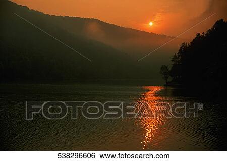 Sunrise over the mountains View Large Photo Image Stock Photograph - Sunrise over the mountains. Fotosearch