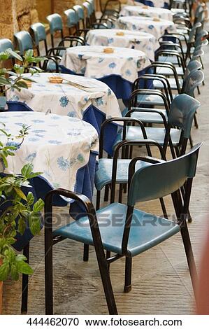 Tables and chairs at a sidewalk cafe, San Gimignano, Siena Province, Tuscany, Italy View Large Photo Image Stock Image - Tables and chairs at a sidewalk cafe, San Gimignano, Siena Province, Tuscany, Italy. Fotosearch