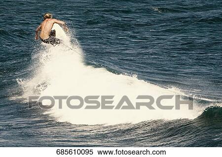 Tourist surfing in the sea, Hookipa Beach, Maui, Hawaii, USA View Large Photo Image Stock Photography - Tourist surfing in the sea, Hookipa Beach, Maui, Hawaii, USA. Fotosearch