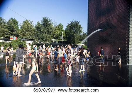 Tourists bathing in a fountain, Crown Fountain, Millennium Park, Chicago, Illinois, USA View Large Photo Image Stock Photo - Tourists bathing in a fountain, Crown Fountain, Millennium Park, Chicago, Illinois, USA. Fotosearch