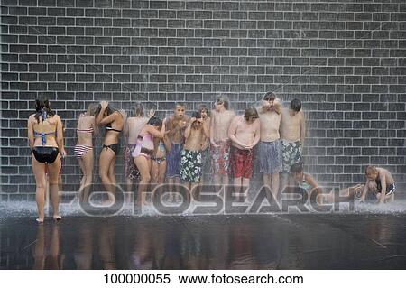 Tourists bathing in a fountain, Crown Fountain, Millennium Park, Chicago, Illinois, USA View Large Photo Image Stock Photography - Tourists bathing in a fountain, Crown Fountain, Millennium Park, Chicago, Illinois, USA. Fotosearch
