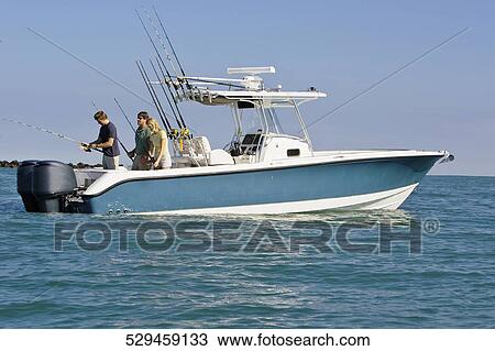 Tourists fishing in the sea View Large Photo Image Stock Image - Tourists fishing in the sea. Fotosearch