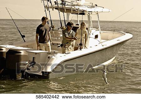Tourists fishing in the sea View Large Photo Image Stock Image - Tourists fishing in the sea. Fotosearch