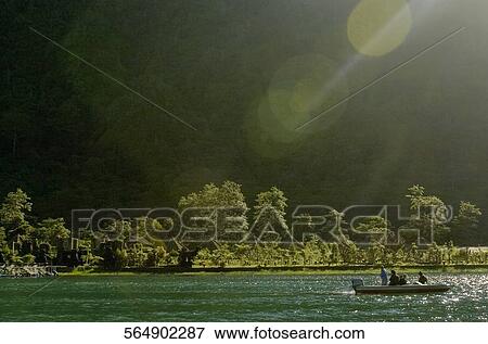 Tourists sitting on a boat in the sea, Tahiti, French Polynesia View Large Photo Image Stock Photo - Tourists sitting on a boat in the sea, Tahiti, French Polynesia. Fotosearch