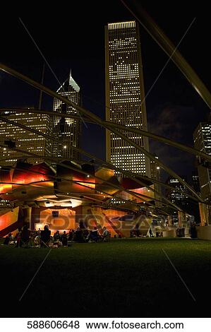 Tourists sitting outside an auditorium, Jay Pritzker Pavillion, Millennium Park, Chicago, Illinois, USA View Large Photo Image Stock Photo - Tourists sitting outside an auditorium, Jay Pritzker Pavillion, Millennium Park, Chicago, Illinois, USA. Fotosearch