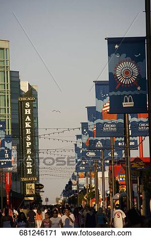 Tourists walking in the street, Navy Pier, Chicago, Illinois, USA View Large Photo Image Stock Image - Tourists walking in the street, Navy Pier, Chicago, Illinois, USA. Fotosearch