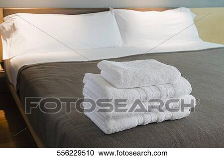 Towels on the bed in a hotel room View Large Photo Image Stock Image - Towels on the bed in a hotel room. Fotosearch