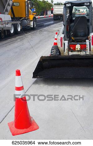 Traffic cone in front of an earth mover at a road construction site, Biscayne Boulevard, Miami, Florida, USA View Large Photo Image Picture - Traffic cone in front of an earth mover at a road construction site, Biscayne Boulevard, Miami, Florida, USA. Fotosearch