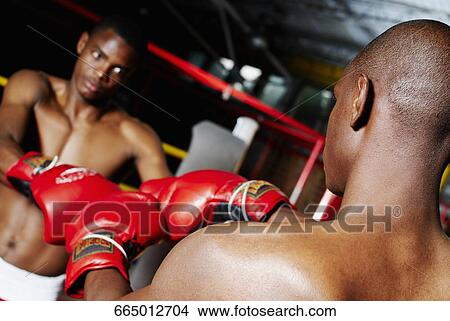 Picture - Two boxers in a boxing ring. Fotosearch