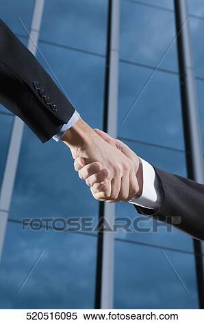 Two businessmen shaking hands View Large Photo Image Stock Photography - Two businessmen shaking hands. Fotosearch