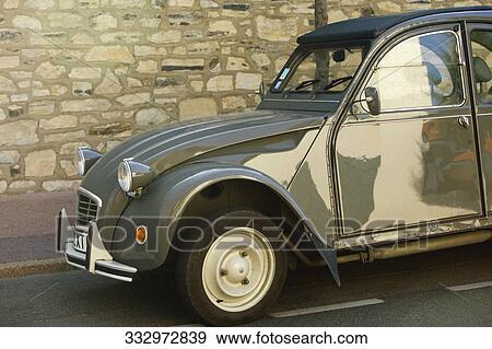 Stock Photo - Vintage car on a road, Citroen 2CV, Biarritz, Aquitaine, France. Fotosearch