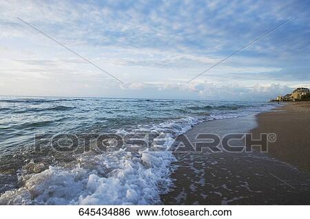 Stock Photograph - Waves on the beach. Fotosearch